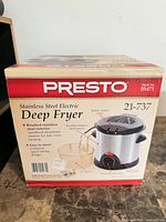 Front of Presto stainless steel electric deep fryer box