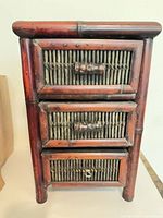 Front view of bamboo three-drawer cabinet