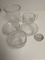 Group shot of six glass and crystal pieces