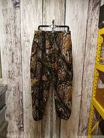 camouflage fleece pants hanging front view