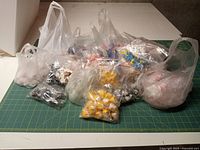 All bags of miniatures spread on cutting mat