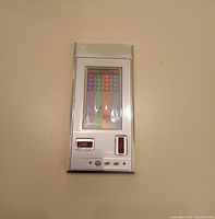 Front view of Nintendo Crab Grab handheld game showing screen, controls and silver casing