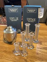 Full lot showing candlesticks, ice bucket and two Marquis boxes