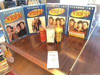 DVD box sets, condiment bottles, napkin dispenser arranged on table