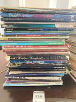 Stack of roughly 30 softcover songbooks