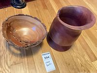 Live-edge bowl and vase together on floor with lot tag