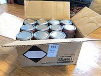 Open UniFlame GelFuel box showing multiple sealed cans