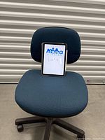 Front view showing blue padded seat and backrest