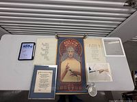 All items laid out: Pete the Cat print, three poem sheets (one framed), Jesus Christ Superstar poster