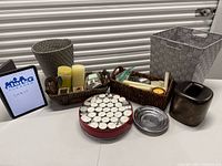 Full lot overview with baskets, candles, dish and vase