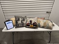 All five pillows displayed on table