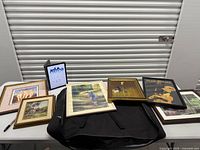 Group shot of all framed artworks on table