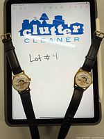 Both Nixon novelty watches on display showing caricature dials and black straps