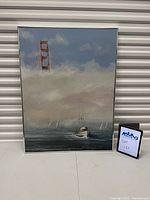 Full view of framed seascape painting