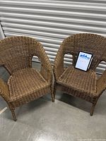 Both wicker chairs front view