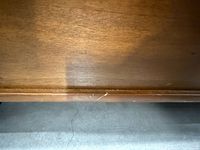 Close-up of lower front panel displaying finish and minor scratch