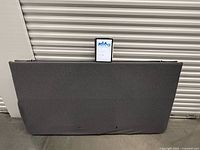 Full exterior side view of grey fabric-wrapped king base