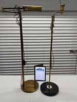 Both floor lamps standing side by side showing overall design and bases