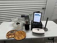 Group shot of all eight kitchen items on table