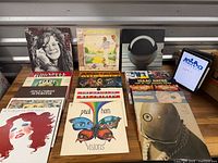 Group shot of all vinyl records standing and lying flat on table
