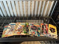 Overall view of entire lot of comics, CD, pamphlet on shelf