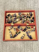 Full view of open box with all chess pieces inside