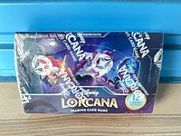 Front view of sealed Disney Lorcana booster box