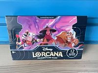 Front of sealed Disney Lorcana booster box showing artwork and pack count