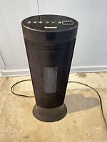 Front view of Honeywell tower heater showing mesh grill and base