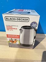 Front view of sealed Black+Decker kettle box displaying product image and specifications