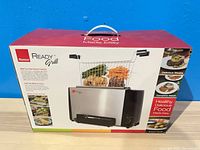 Front of boxed Ronco Ready Grill showing product image and branding