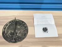 Top view of sundial and instruction sheet