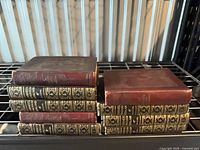 Stack of all ten books on shelving