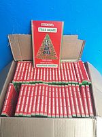 Open carton showing dozens of Barcana Tree Drape boxes
