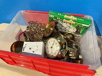 Red tote with brass hardware, clock dial, boxed set, cube box