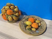 Lidded ceramic container and matching plate showing full set