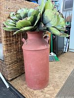 Full view of milk can with faux cactus arrangement