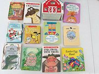 All 12 pop-up books laid out in three rows