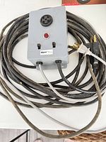 Front view of Myers TA11-LC alarm with attached power cord