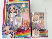 Both sealed Rainbow High doll boxes side by side