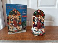 Box and lit figurine side by side