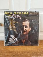 Front cover of Neil Sedaka LP in plastic sleeve