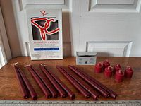 Box of President’s Choice dripless candles, group of tapers, box of votives, six votive candles