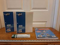 Group shot of two Hilroy filler paper packs, pencil box, and printer paper pack