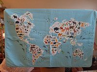 Front of wall hanging showing animal world map design