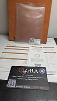 GRA warranty card, certificate paperwork and sleeve