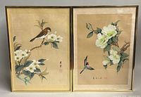 Both framed silk paintings side by side