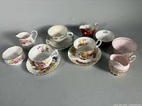 Group view of all teacups, saucers, creamers, sugars