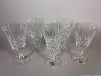 Five Waterford cut crystal stemware glasses upright
