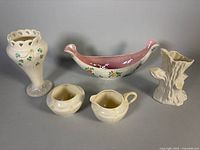 All five ceramic items arranged